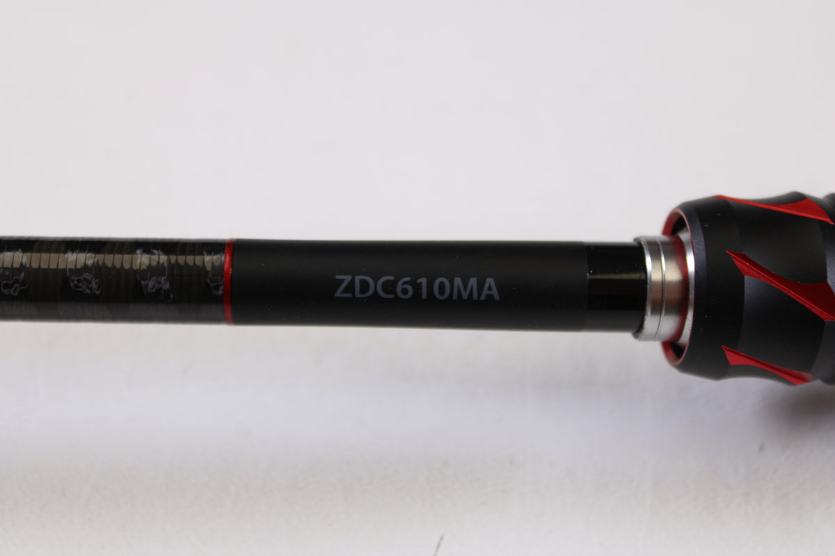 A close-up of a Shimano Zodias ZDC610MA 6'10" Medium Used Casting Rod in excellent condition, showing black with red accents and the code "ZDC610MA" in white. Ideal for trade-ins through the Nation's Best Rod and Reel Trade-In Program. Plain white background.