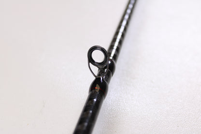 Close-up of a Shimano Zodias ZDC610MA 6'10" Medium Used Casting Rod in excellent condition, focusing on a line guide against a white background—ideal for trading in gear at the Nation's Best Rod and Reel Trade-In Program for store credit.