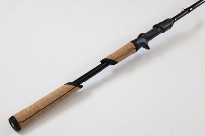 A close-up of the St. Croix Mojo Bass JOC710XHM Mag Cranker 7'10" XH—Used Casting Rod in mint condition, featuring a cork handle and black accents, ideal for those using our Rod & Reel Trade-In Program for store credit.