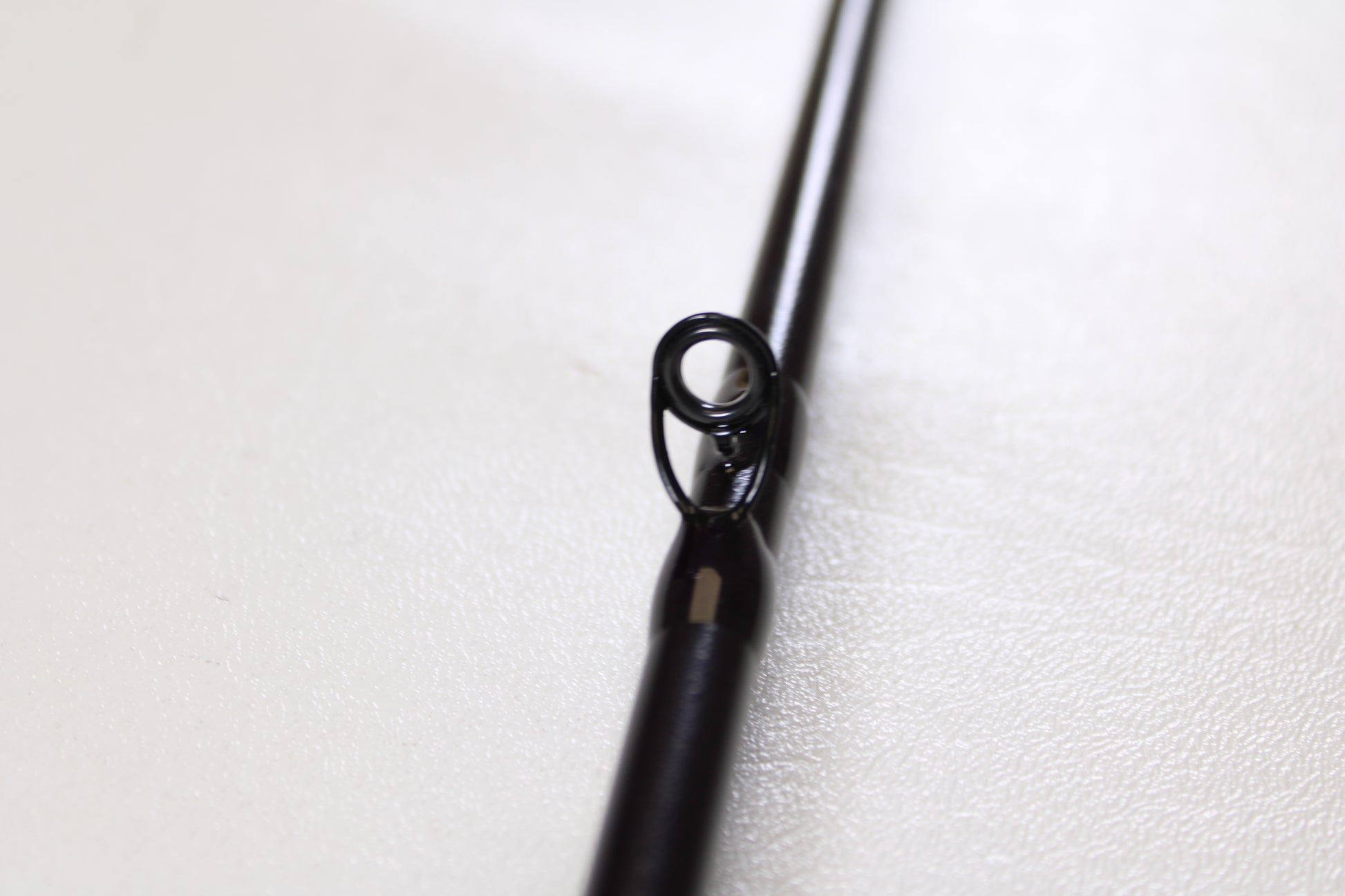 Close-up of the guide ring on a St. Croix Mojo Bass JOC710XHM Mag Cranker 7'10" XH Used Casting Rod—mint condition and ideal for anglers upgrading gear or considering our Rod and Reel Trade-In Program.