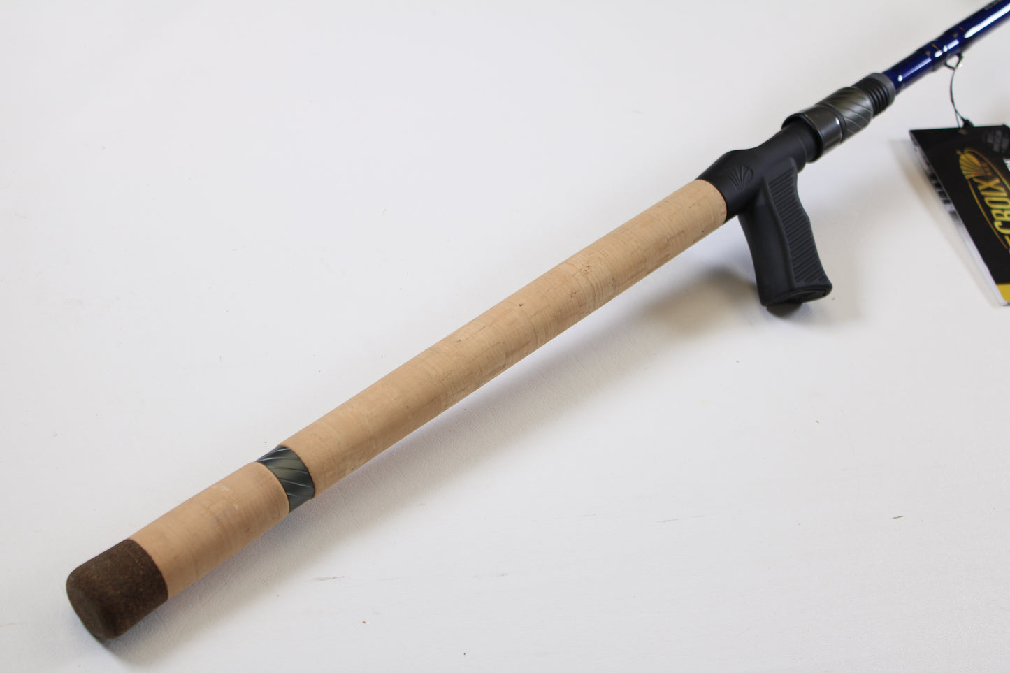 A St. Croix Legend Tournament Bass LBTC710XHF 7'10" XH used casting rod with a light wood grip, dark butt cap, and black reel seat and trigger rests on a white surface—ideal for our Rod and Reel Trade-In Program for store credit.