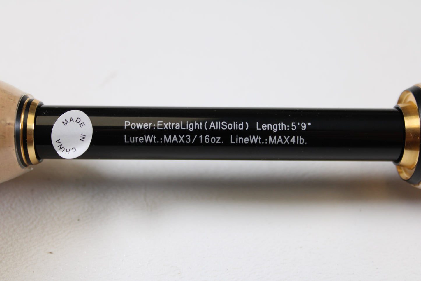 Close-up of a Raid Japan Gladiator Maximum GX-59XLS-AS Solid Maxx XL 5'9" Extra Light spinning rod (used, mint), specs: "MAX 3/16 oz lure, MAX 4 lb line." "Made in China" sticker visible—ideal for trade-ins or used gear seekers.