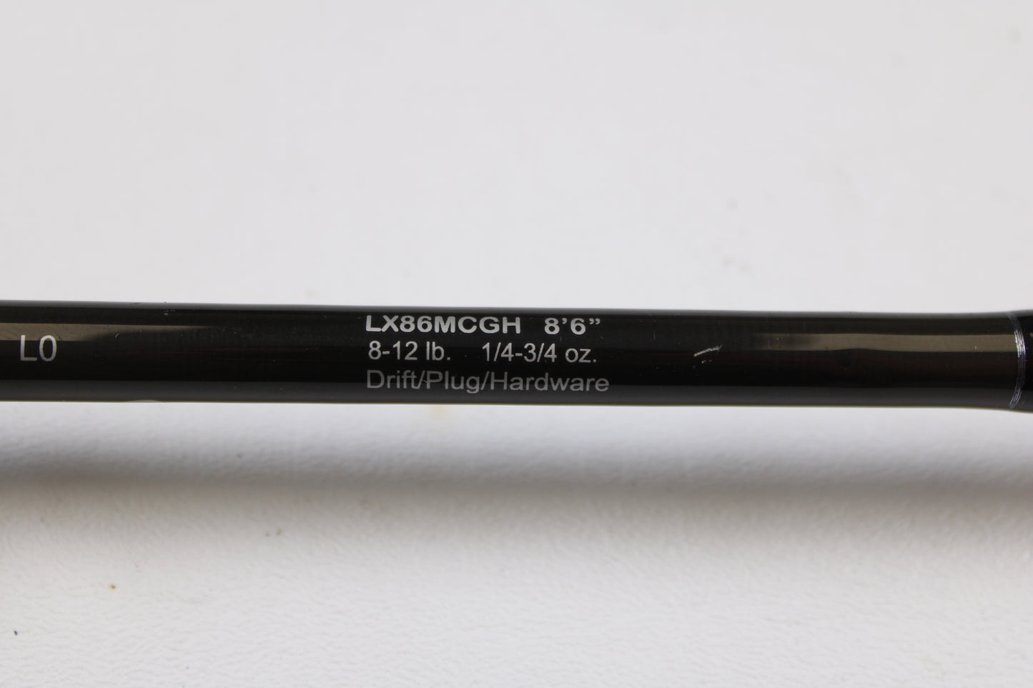 Close-up of a Lamiglas X11 Graphite Handle LX86MCGH 8'6" Medium 2 Piece Used Casting Rod—Excellent Condition, showing specs: 8-12 lb, 1/4-3/4 oz—ideal for our used gear or rod and reel trade-in program.