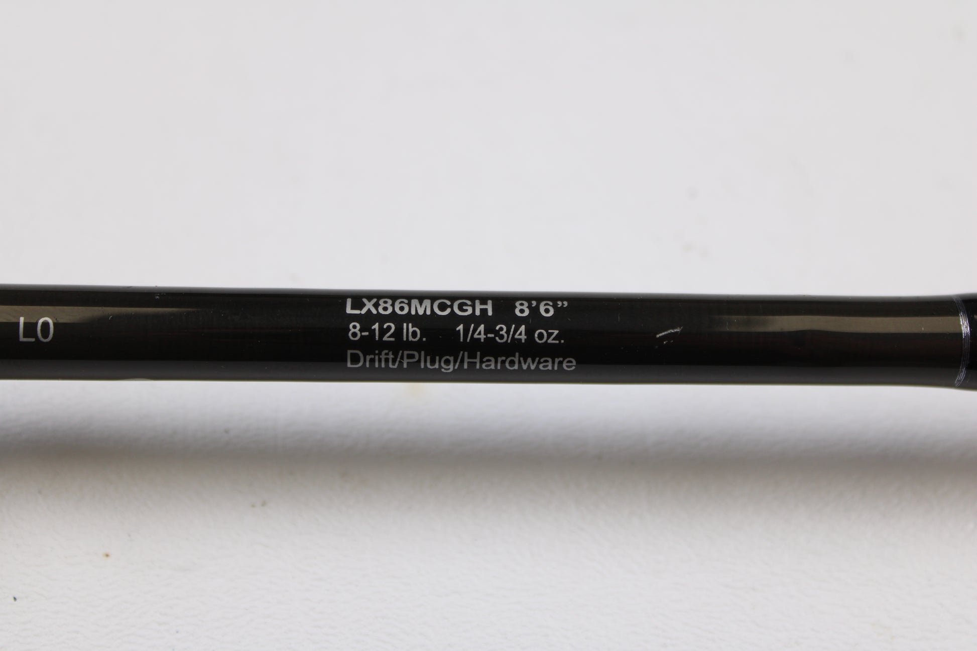 Close-up of a Lamiglas X11 Graphite Handle LX86MCGH 8'6" Medium 2 Piece Used Casting Rod—Excellent Condition, showing specs: 8-12 lb, 1/4-3/4 oz—ideal for our used gear or rod and reel trade-in program.