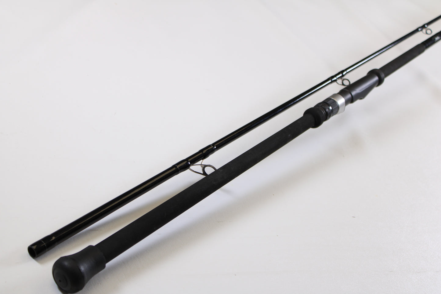 The Century SlingShot SS 1265 10'6" 2 Piece Used Spinning Rod—Excellent Condition—features a padded handle and metal guides, making it an ideal candidate for our Rod and Reel Trade-In Program if you want to upgrade your gear.