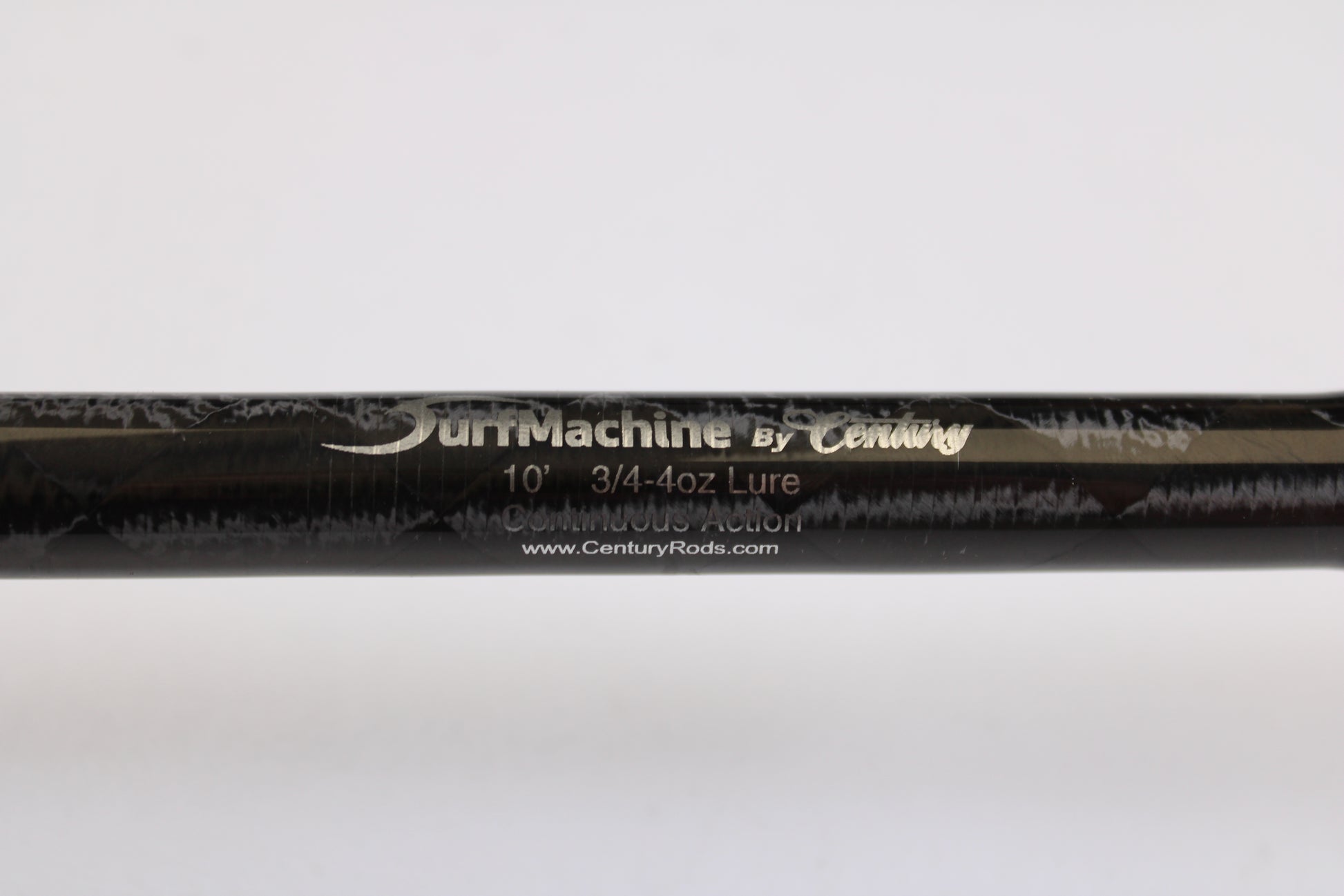 Close-up of a black Century SurfMachine SM10L 10'0" 2-piece spinning rod in excellent used condition, with specs and "www.CenturyRods.com" on the rod. Ask about our Rod and Reel Trade-In Program for store credit!.