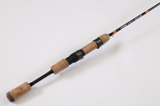 The G. Loomis GCX Lite 6600S 5'6" Ultra Light Used Spinning Rod features a cork handle and black reel seat with orange and black accents, shown on a white background—ideal for anglers upgrading their gear. Excellent condition.