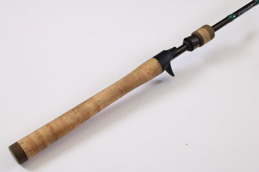 A close-up of a G. Loomis Conquest CNQ 783C MBR 6'6" Medium Heavy Casting Rod handle, in excellent used condition—trade in your gear for store credit or upgrade with our Rod and Reel Trade-In Program.