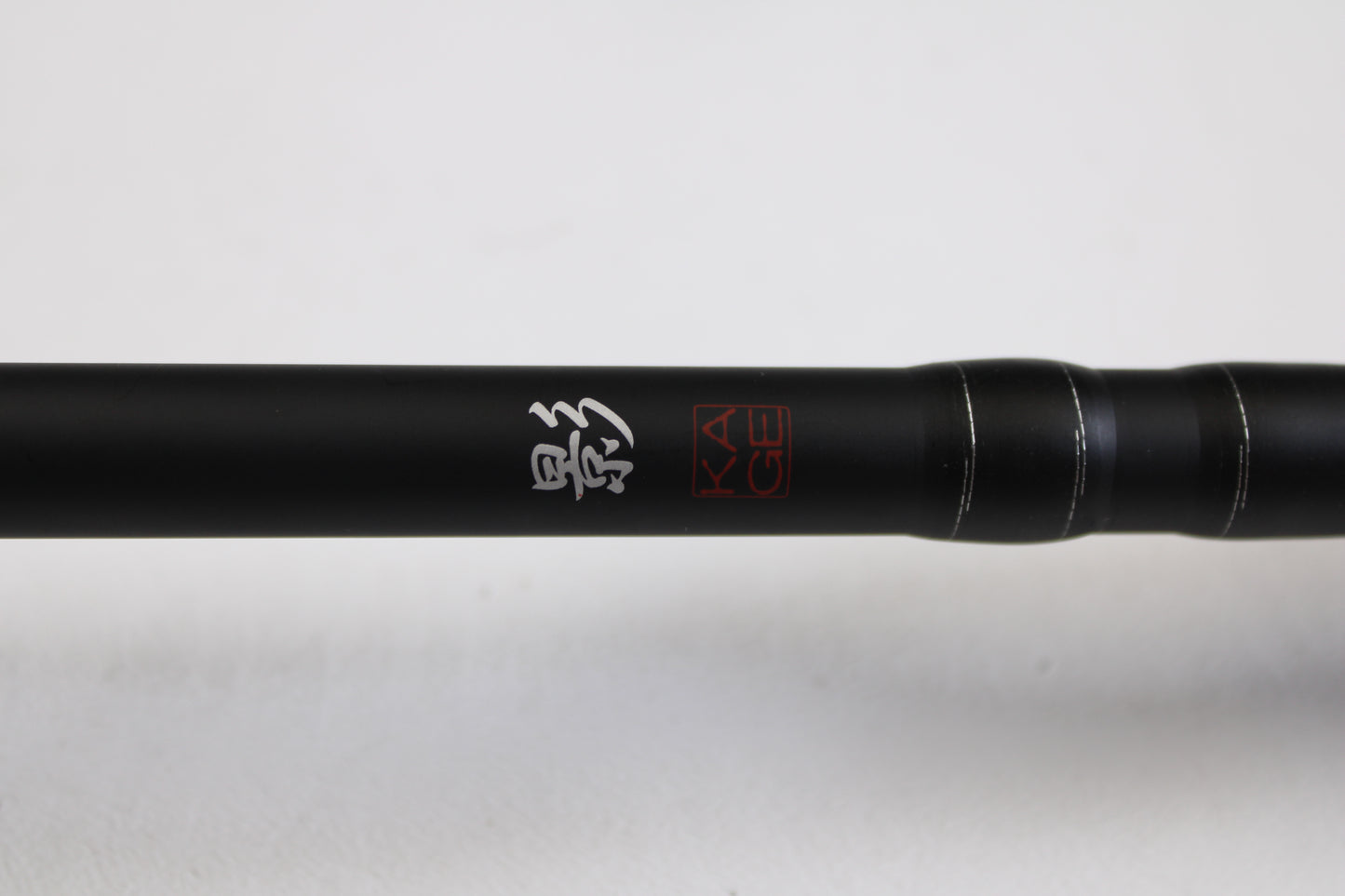 A close-up of the Daiwa Kage KAG761HRB-G Deep Crank 7'6" Heavy casting rod in excellent used condition, featuring white Japanese characters and a red "KAGE" logo—ideal for those seeking quality pre-owned rods or trading in gear.
