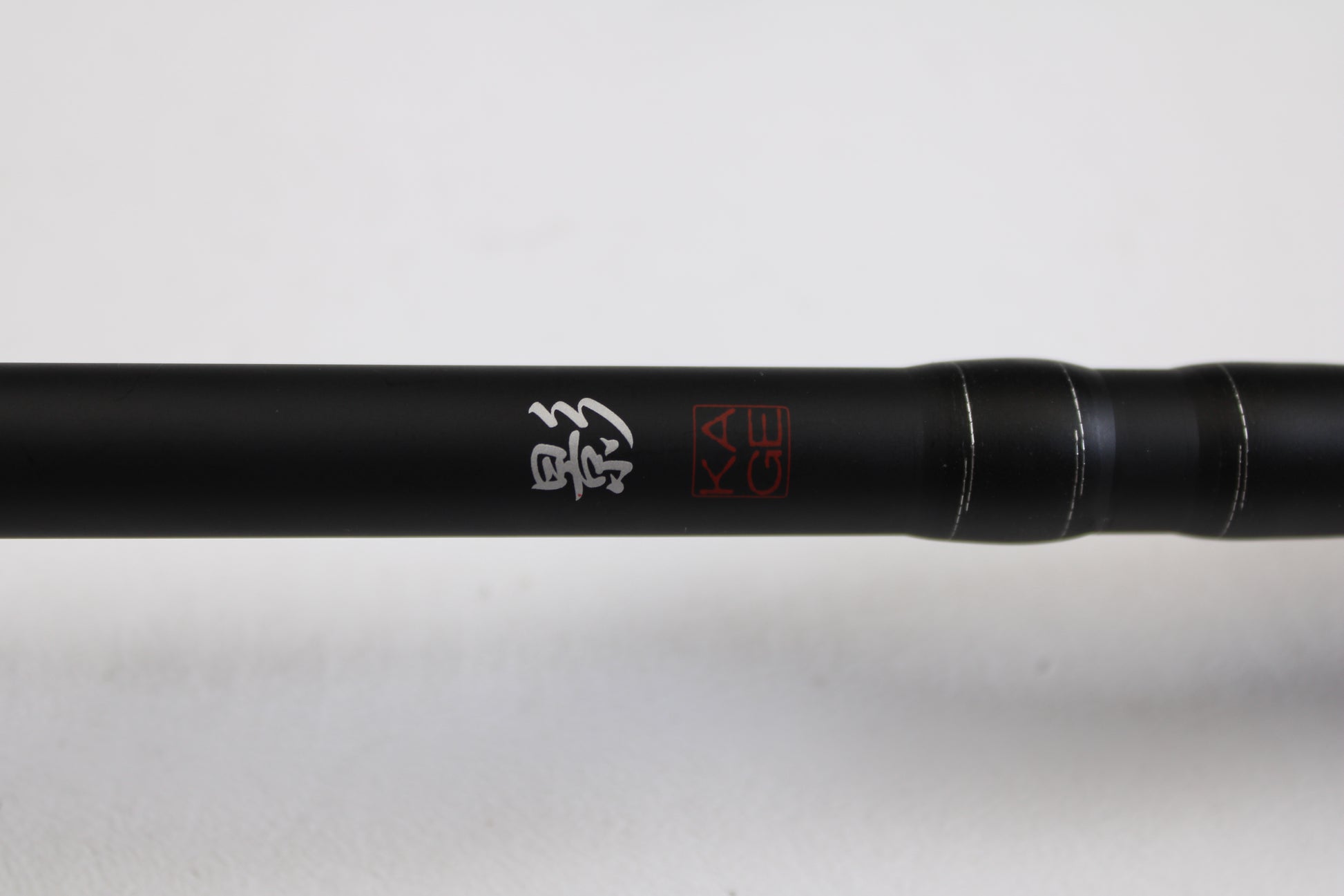 A close-up of the Daiwa Kage KAG761HRB-G Deep Crank 7'6" Heavy casting rod in excellent used condition, featuring white Japanese characters and a red "KAGE" logo—ideal for those seeking quality pre-owned rods or trading in gear.