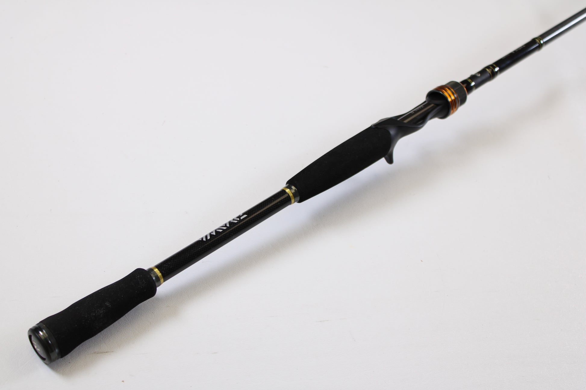 A Daiwa Tatula TAT761HFB 7'6" Heavy Used Casting Rod in excellent condition, shown on a white background—ideal for our Rod and Reel Trade-In Program, where you can earn store credit for your used gear.