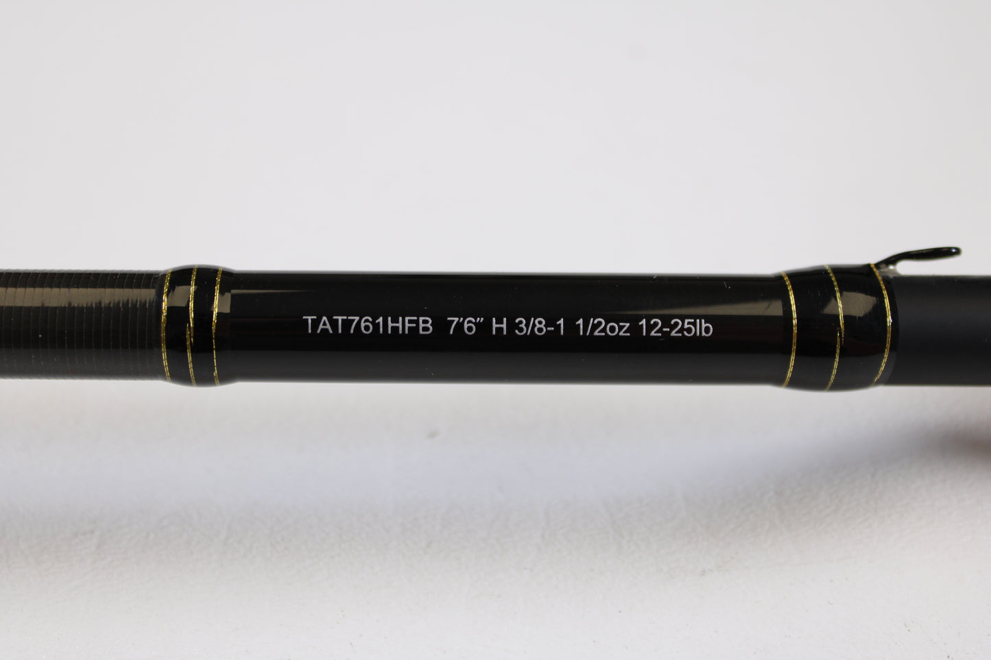 Close-up of the Daiwa Tatula TAT761HFB 7'6" Heavy - Used Casting Rod in excellent condition, showing specs on the shaft—eligible for our Rod and Reel Trade-In Program and used gear store credit.