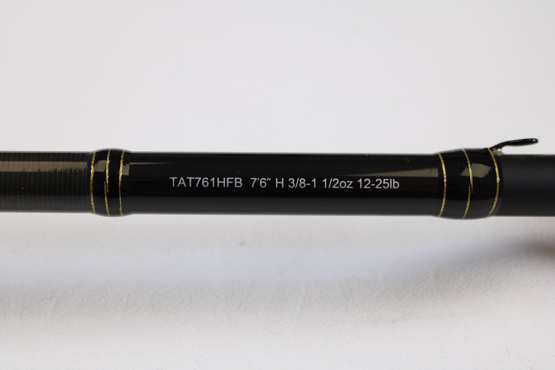 Close-up of the Daiwa Tatula TAT761HFB 7'6" Heavy - Used Casting Rod in excellent condition, showing specs on the shaft—eligible for our Rod and Reel Trade-In Program and used gear store credit.