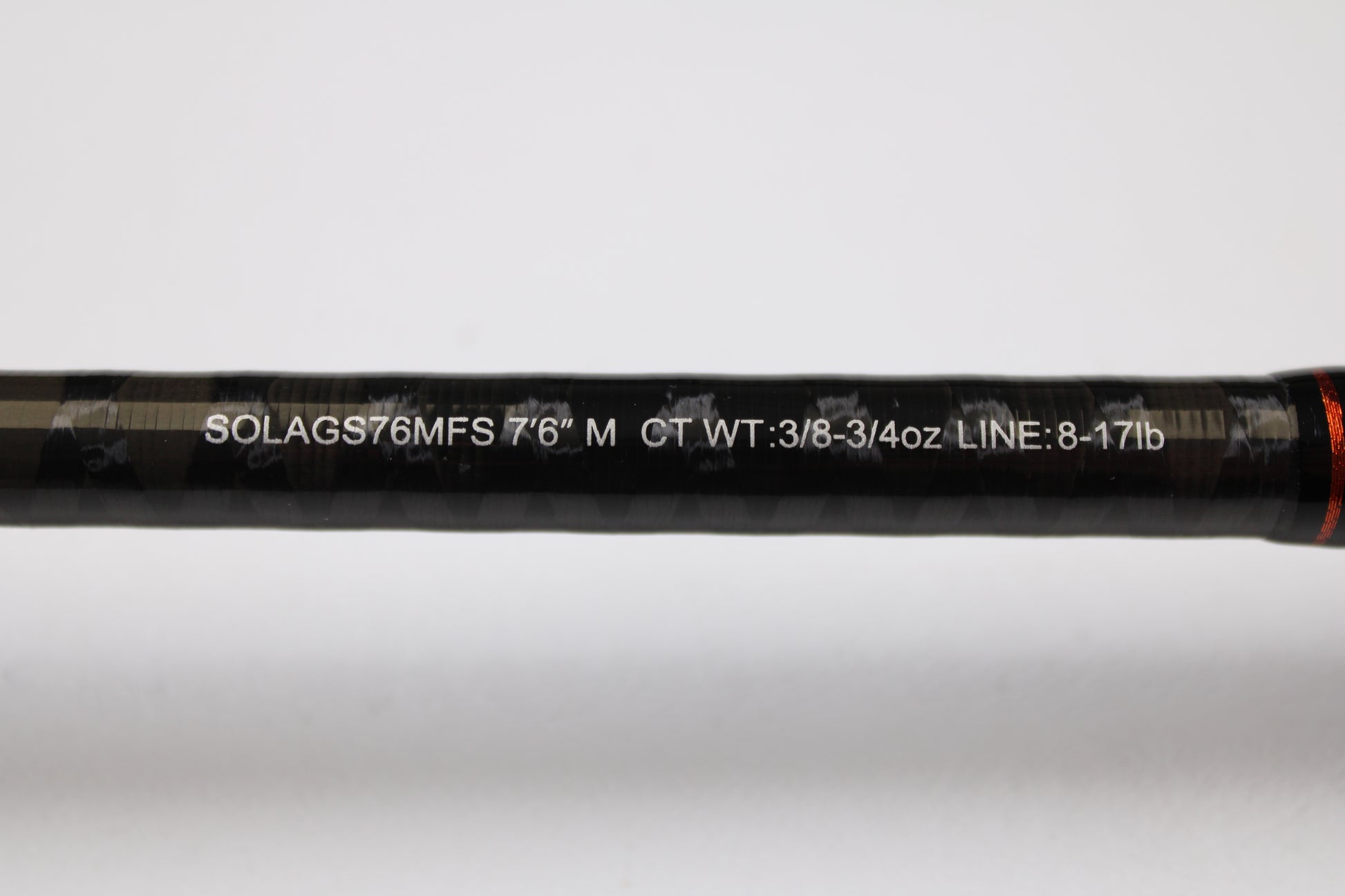 Close-up of a Daiwa Sol AGS SOLAGS76MFS 7'6" Medium Used Spinning Rod in excellent condition, showing specs printed in white on the black rod—eligible for our Rod and Reel Trade-In Program for store credit.