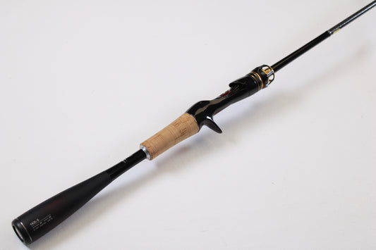 A Shimano Poison Ultima 162L-S 6'2" Light used casting rod in very good condition, featuring a sleek black finish and cork handle, is shown on a white background—ideal for those interested in our Rod and Reel Trade-In Program for store credit.