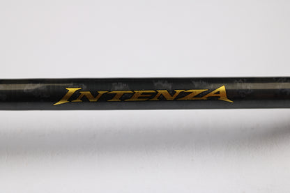 A close-up of a Shimano Intenza A NTZC72MHA 7'2" Medium Heavy Used Casting Rod in good condition, featuring gold "INTENZA" lettering on black—great for used gear fans or those seeking store credit via our trade-in program.