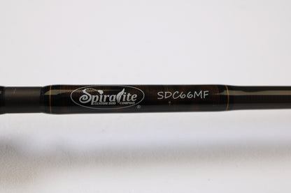 Close-up of the Spiralite Defiant SDC66MF 6'6" Medium used casting rod in excellent condition, showing the brand logo and model number in white—ideal for upgrading your tackle or finding quality used gear.
