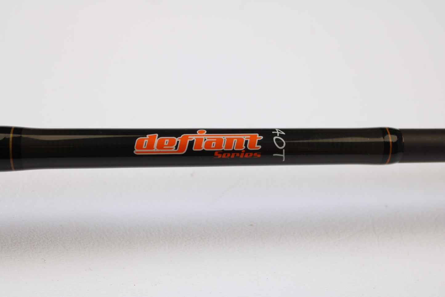 A close-up of a Spiralite Defiant SDC66MF 6'6" Medium Used Casting Rod in excellent condition, with "defiant Series 40T" lettering—ideal for those using our rod and reel trade-in program or store credit on pre-owned gear.
