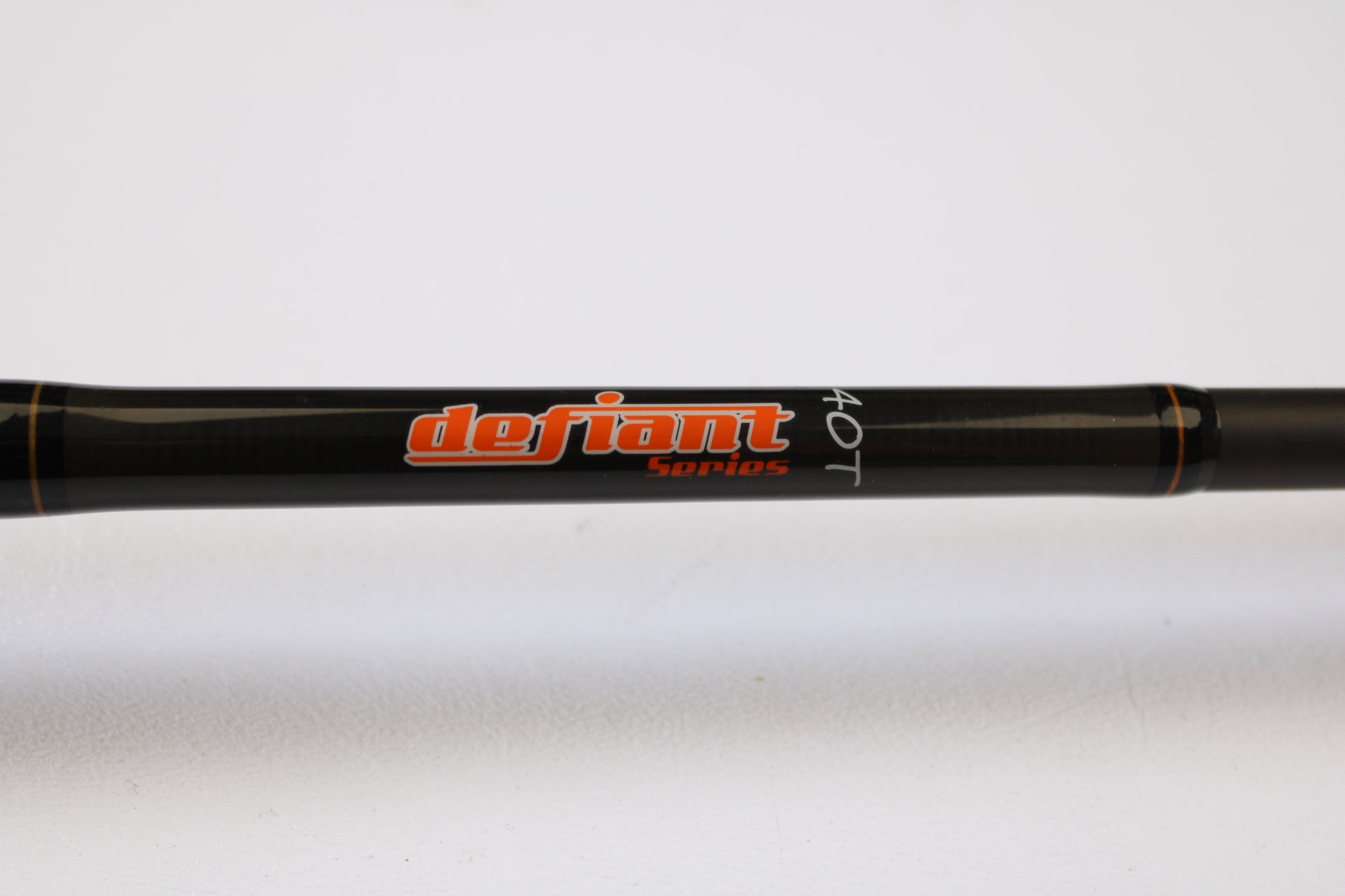 A close-up of a Spiralite Defiant SDC66MF 6'6" Medium Used Casting Rod in excellent condition, with "defiant Series 40T" lettering—ideal for those using our rod and reel trade-in program or store credit on pre-owned gear.