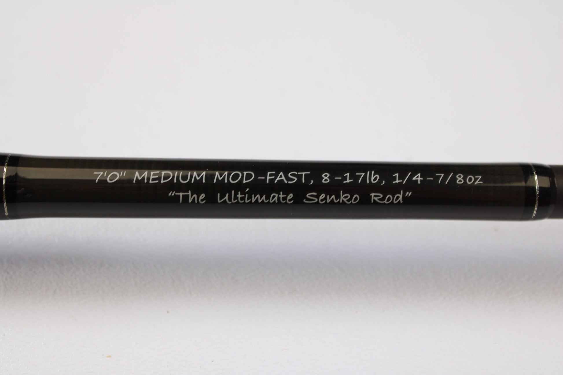 A close-up of the Spiralite Maverick SMC70MMF 7'0" Medium Used Casting Rod in excellent condition with crisp white lettering. Trade in your used gear for store credit through our Rod and Reel Trade-In Program.
