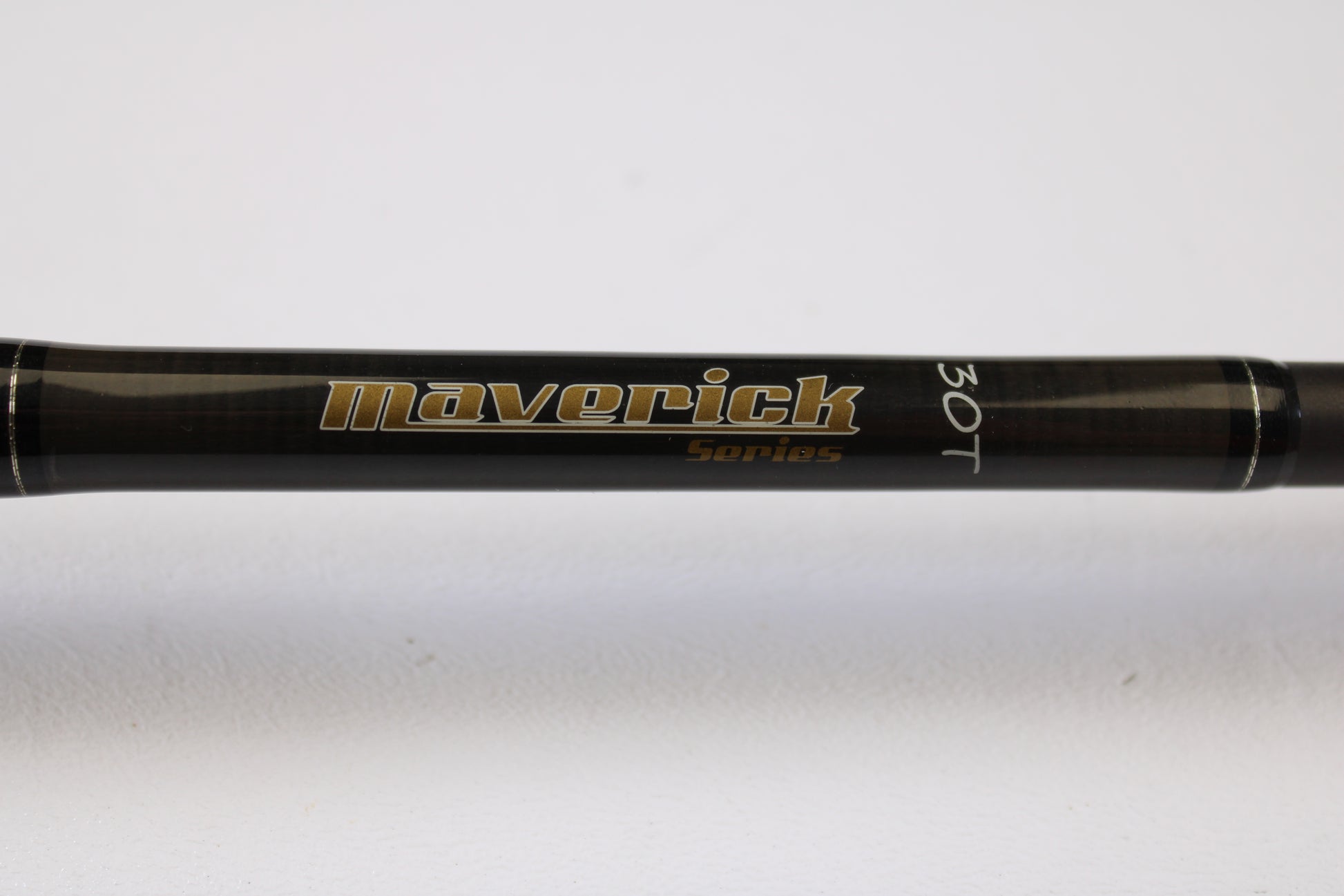 Close-up of a Spiralite Maverick SMC70MMF 7'0" Medium Used Casting Rod with gold and white text—eligible for our Rod and Reel Trade-In Program if you want to upgrade your used Spiralite gear.