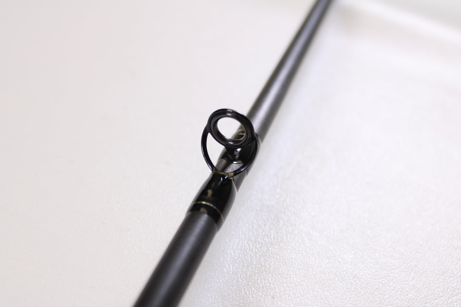 Close-up of the Spiralite Maverick SMC70MMF 7'0" Medium Used Casting Rod in excellent condition, highlighting the metal guide—ideal for those considering our Rod and Reel Trade-In Program or shopping quality used gear.
