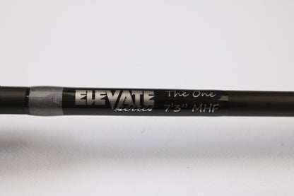 A close-up of a Stik5 Elevate Series The One 7'3" Medium Heavy used casting rod in excellent condition with silver and white text, perfect for upgrading via our rod and reel trade-in program.