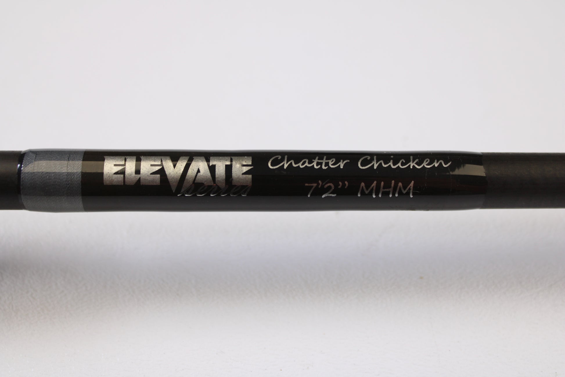 Close-up of the Stik5 Elevate Series Chatter Chicken 7'2" Medium Heavy Used Casting Rod in excellent condition, silver text on black, shown against a white background. Available now through our Rod and Reel Trade-In Program.