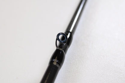 Close-up of a Daiwa Tatula TTU 731HRB-SB 7'3" Heavy Swimbait Used Casting Rod in mint condition, highlighting a line guide against a white background—perfect for trade-in customers or those seeking quality used gear.