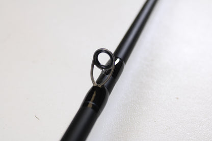 Close-up of a Dobyns Champion XP DC705CBGLASS 7'0" Medium Heavy Glass Used Casting Rod in excellent condition, showcasing its line guide—ideal for anglers seeking quality pre-owned gear from Dobyns.