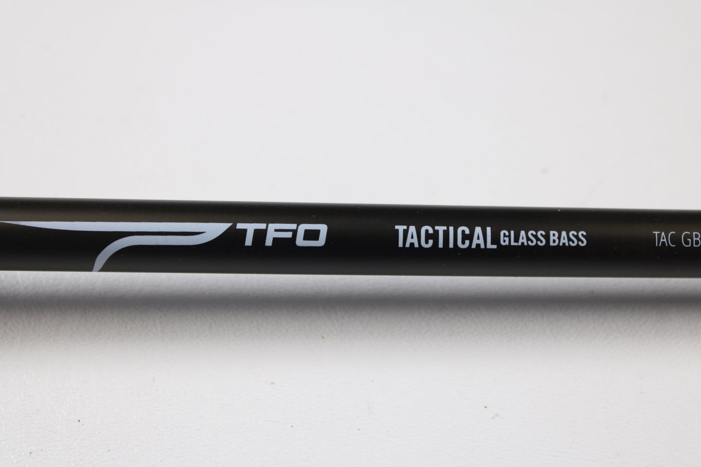 A close-up of the Temple Fork TFO Tactical Glass Bass TACGBCB745-1 7'4" Medium Heavy used casting rod in excellent condition. Trade in your gear for store credit with our Rod and Reel Trade-In Program.