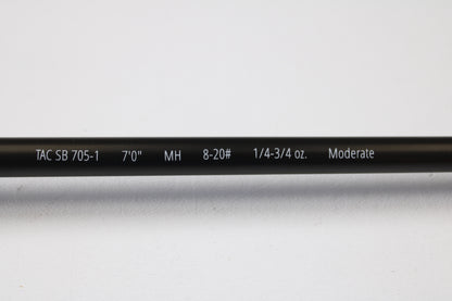 A close-up of the Temple Fork TFO Tactical Bass TACSB7051-3 7'0" Medium Heavy Casting Rod (used, excellent) highlights its features—ideal for anglers trading up through our Rod and Reel Trade-In Program.