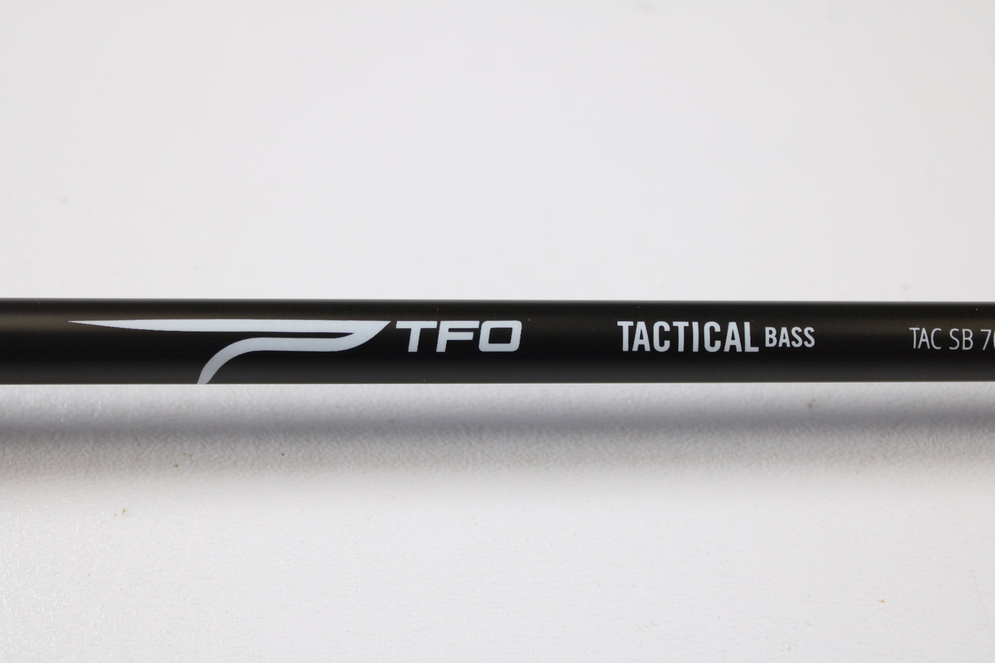 Close-up of a Temple Fork TFO Tactical Bass TACSB7051-3 7'0" Medium Heavy Used Casting Rod in excellent condition—ideal for our Rod and Reel Trade-In Program if you're looking to upgrade your fishing gear.