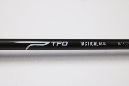 Close-up of a Temple Fork TFO Tactical Bass TACSB7051-3 7'0" Medium Heavy Used Casting Rod in excellent condition—ideal for our Rod and Reel Trade-In Program if you're looking to upgrade your fishing gear.