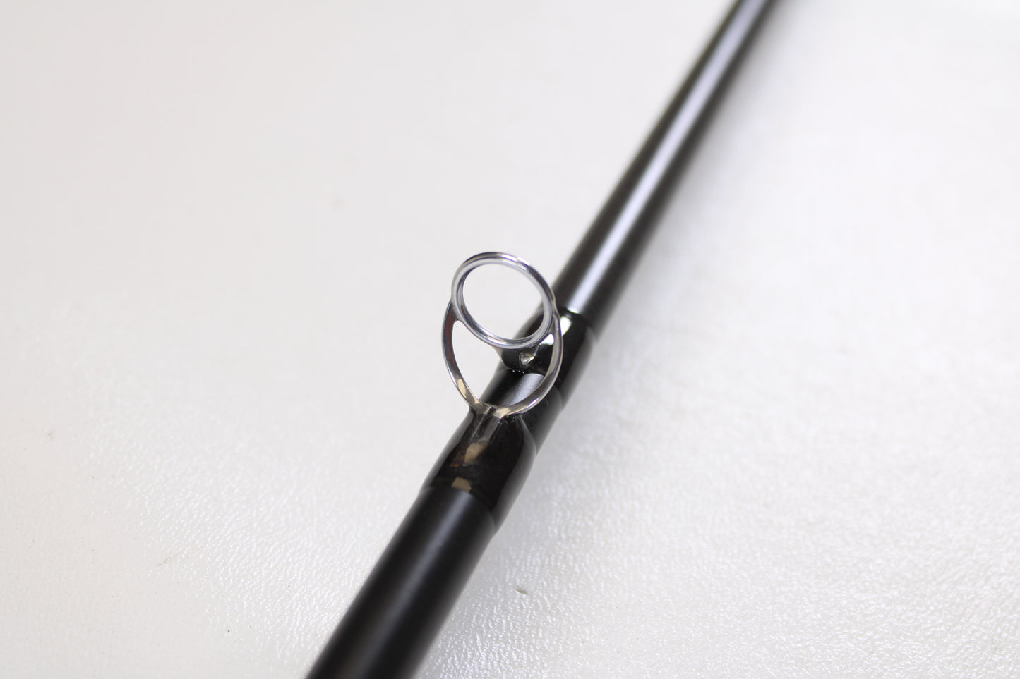 A close-up of the Temple Fork TFO Tactical Bass TACSB7051-3 7'0" Medium Heavy Used Casting Rod in excellent condition—ideal for those exploring our Rod and Reel Trade-In Program or seeking quality pre-owned gear.