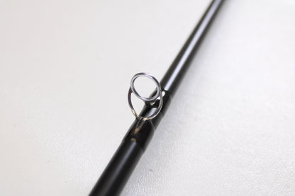 A close-up of the Temple Fork TFO Tactical Bass TACSB7051-3 7'0" Medium Heavy Used Casting Rod in excellent condition—ideal for those exploring our Rod and Reel Trade-In Program or seeking quality pre-owned gear.
