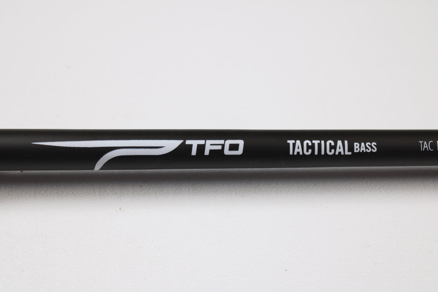 Temple Fork TFO Tactical Bass TACMBR734-1 7'3" Medium Used Casting Rod in excellent condition, featuring "TFO TACTICAL BASS" in white on a black rod. Great for those trading rods or earning store credit on used gear.