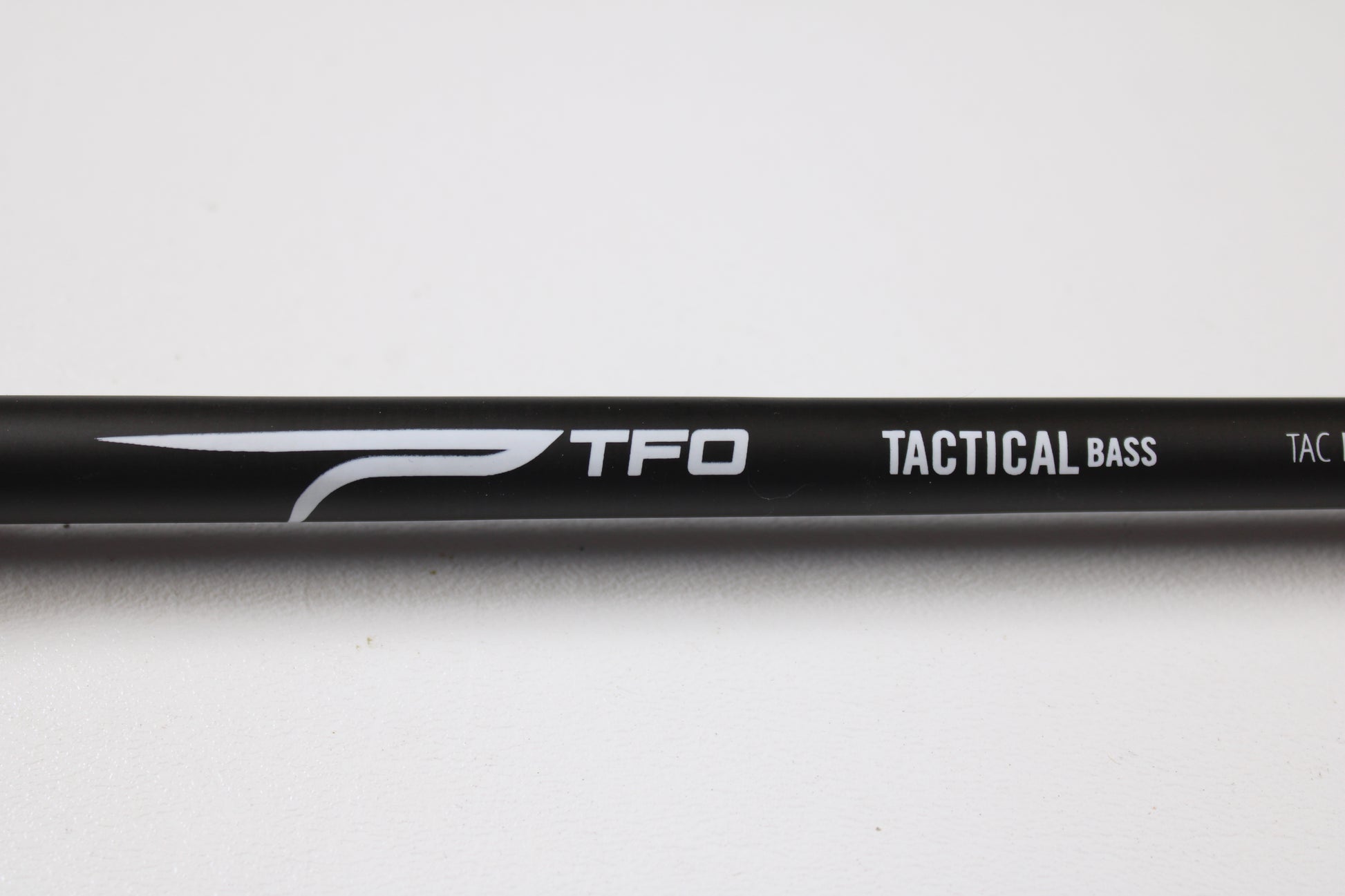 Temple Fork TFO Tactical Bass TACMBR734-1 7'3" Medium Used Casting Rod in excellent condition, featuring "TFO TACTICAL BASS" in white on a black rod. Great for those trading rods or earning store credit on used gear.