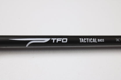 Temple Fork TFO Tactical Bass TACMBR734-1 7'3" Medium Used Casting Rod in excellent condition, featuring "TFO TACTICAL BASS" in white on a black rod. Great for those trading rods or earning store credit on used gear.