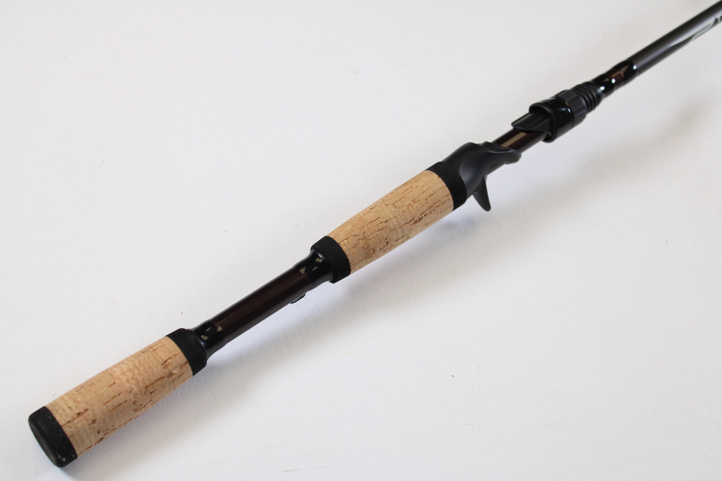 A close-up of the Temple Fork TFO Tactical Bass TACSB726-1 7'2" Heavy, a used casting rod in excellent condition—great for anglers interested in quality pre-owned gear or looking to trade in rods and reels for store credit.