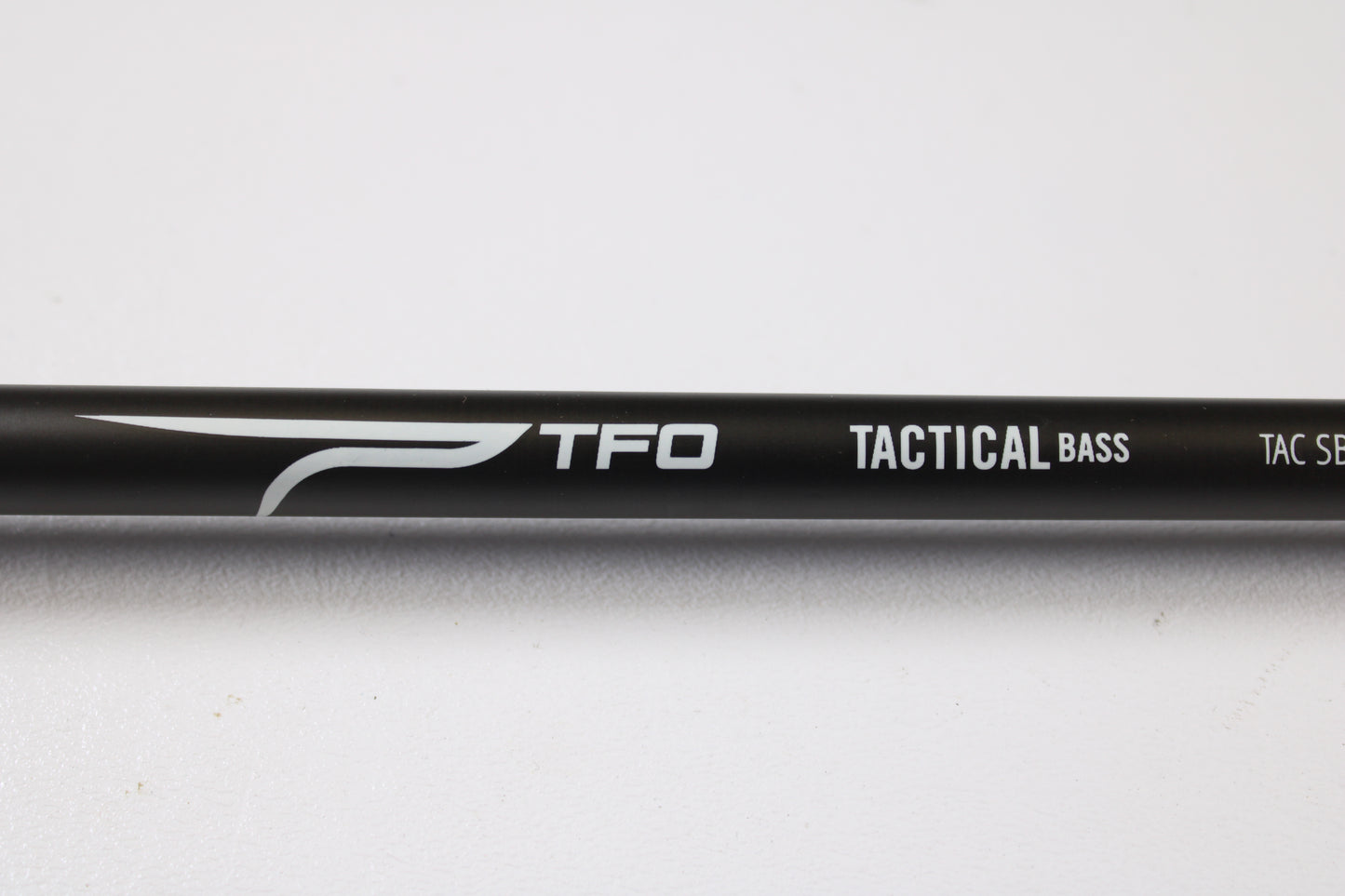 Close-up of a Temple Fork TFO Tactical Bass TACSB726-1 7'2" Heavy used casting rod in excellent condition, ideal for maximizing store credit through our rod and reel trade-in program, shown against a white background.