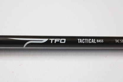 Close-up of a Temple Fork TFO Tactical Bass TACSB726-1 7'2" Heavy used casting rod in excellent condition, ideal for maximizing store credit through our rod and reel trade-in program, shown against a white background.