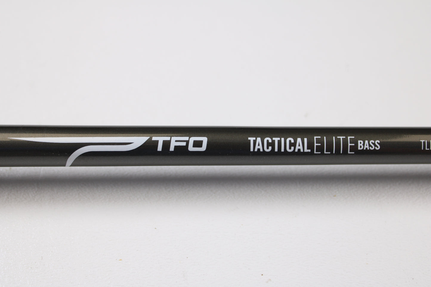 A close-up of a Temple Fork TFO Tactical Elite Bass TLE SC 747-1 7'4" Ex-Heavy Used Casting Rod in excellent condition—ideal for anglers seeking quality used rods or those interested in our rod and reel trade-in program.