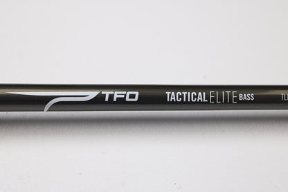 A close-up of a Temple Fork TFO Tactical Elite Bass TLE SC 747-1 7'4" Ex-Heavy Used Casting Rod in excellent condition—ideal for anglers seeking quality used rods or those interested in our rod and reel trade-in program.