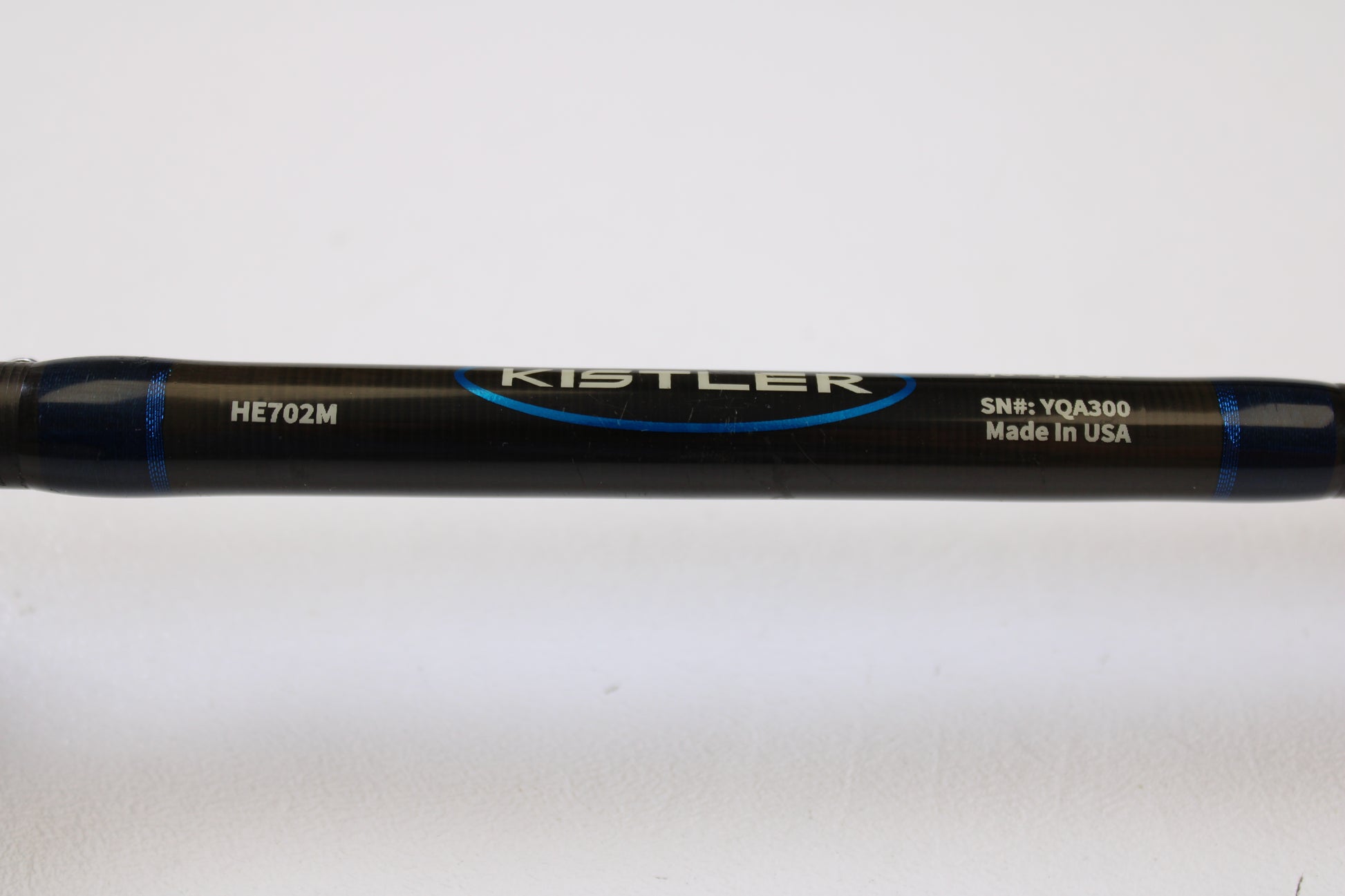Close-up of a Kistler Helium HE702M 7'0" Medium Used Casting Rod in very good condition, featuring the brand name and model—ideal for Rod and Reel Trade-In or earning store credit on used gear.