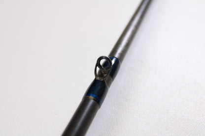 Close-up of a Kistler Helium HE702M 7'0" Medium Used Casting Rod in very good condition, showing the guide ring with blue thread wraps. Ideal for those considering a Rod and Reel Trade-In or upgrading used gear for store credit. White background.