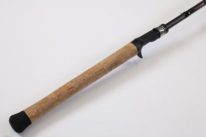 A close-up of the Kistler KFGS73 Frog and Slop Special 7'3" Heavy Used Casting Rod handle—featuring a cork grip and black reel seat—ideal for customers interested in our Rod and Reel Trade-In Program for store credit.
