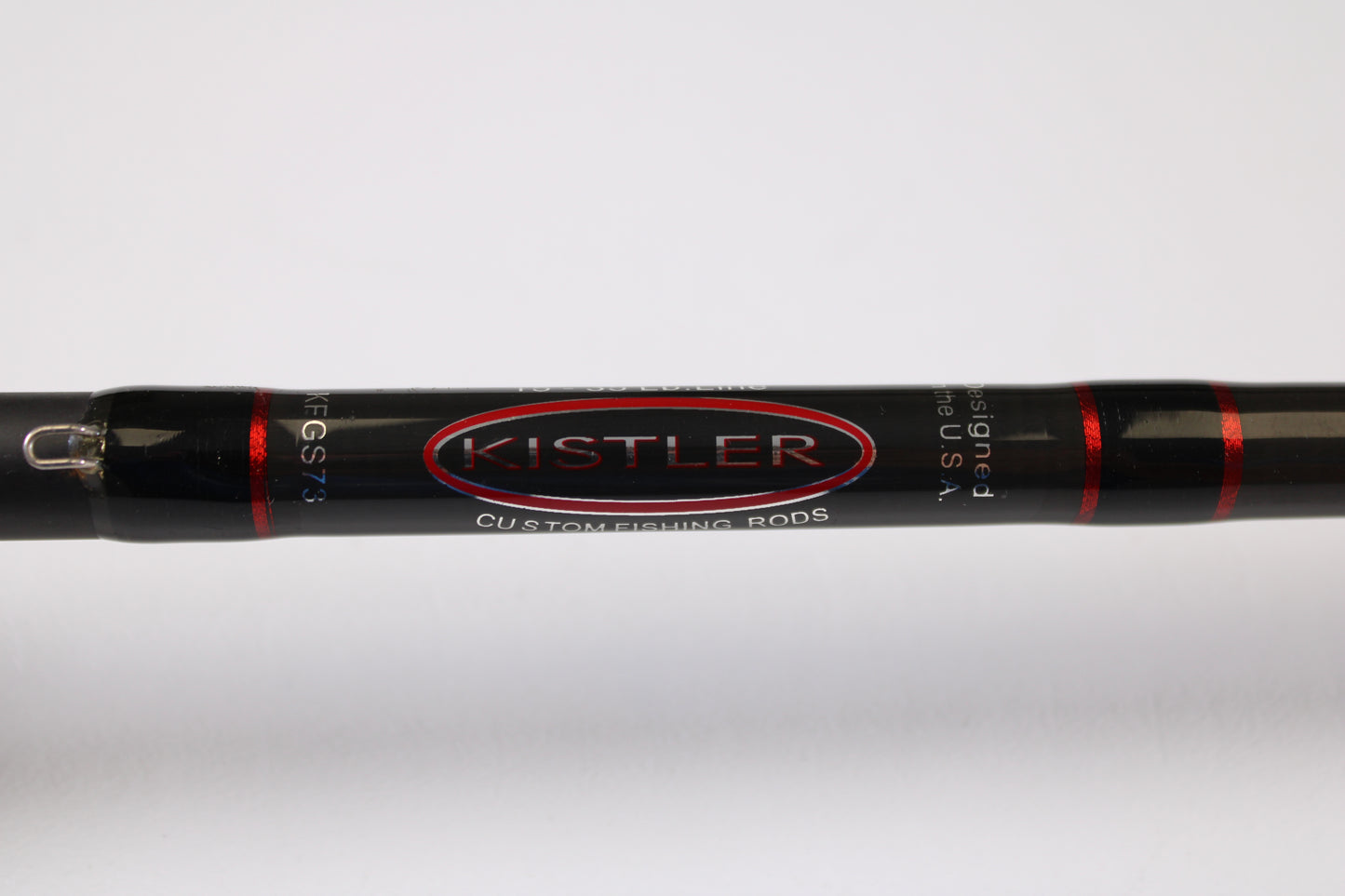 Close-up of a black Kistler KFGS73 Frog and Slop Special 7'3" Heavy used casting rod in very good condition, featuring red accents and white branding—ideal for fans of pre-owned gear or our Rod and Reel Trade-In Program. Plain white background.