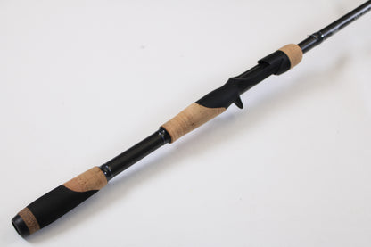 A close-up of the Fenwick World Class Bass WLDB75H-XFC 7'5" Heavy Casting Rod—Used, Excellent Condition—on a white background, ideal for our trade-in program where your used gear earns valuable store credit.