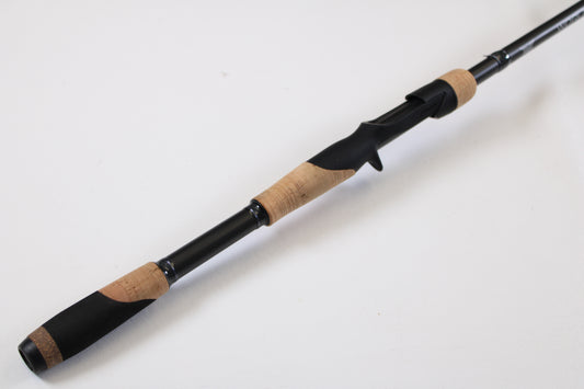 A close-up of the Fenwick World Class Bass WLDB75H-XFC 7'5" Heavy Casting Rod—Used, Excellent Condition—on a white background, ideal for our trade-in program where your used gear earns valuable store credit.